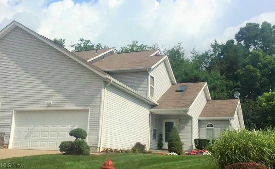 WELCOME HOME, FOLKS! This darling 3 bedroom, 2 full bath condo is located on a dead-end street in Tallmadge near shopping and many restaurants. This property features vaulted ceilings, lots of natural light from large windows and a sky light, and an open floor plan. The two car attached garage has hot and cold water available with extra loft storage. This home also has a private patio area ready for relaxation or entertaining! New AC in 2014, new oil rubbed bronze fixtures throughout, and brand new toilet installed in the first floor full bath.   Call TODAY for your private showing.