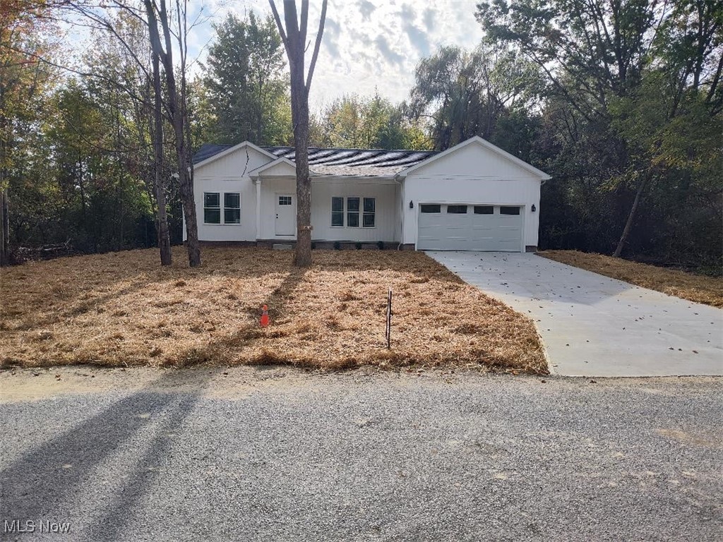 New construction! Three-bedroom Ranch home with two full bathrooms, full basement and a two-car attached garage on a beautiful, wooded lot with a lake view. Lake Roaming Rock is across the street with lake access nearby. 2X6 construction. Tightly insulated. Solid Maple trim. Solid, locally built, custom-made Maple cabinets. Rev wood flooring by Mohawk. Home includes Granite counter tops, Ohio manufactured Whirlpool appliances, Central AC, and concrete drive and sidewalk. Lake Roaming Rock is one of the best Bass fishing lakes in Ohio. Enjoy the Clubhouse, beaches, heated pools, volleyball court, tennis and pickle ball courts, picnic pavilions, boating, skiing and much more.