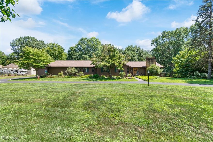 Check out this one of a kind ranch with 5 bedrooms, 3 full baths and over 3400 sq. ft. of finished space all on 1.42 acres. This one is unique and offers many updates, upgrades and cool features, so pay attention to detail. Located on a quiet dead end street in the Marlington School District. As soon as you pull up you will notice the circular driveway, meticulous exterior, plus the 6 car garage. There is an oversized 2 car attached plus a 26x30 detached garage built in 2005. The back yard is amazing with a back stamped concrete patio new in 2021 with private views of the back yard. Truly a must see. Roof/Gutters new in 2023. There is also a 12x16 storage shed. Inside features an open floor plan with a new kitchen in 2014 with stainless steel appliances including a double oven. Kitchen opens up to a massive 25x19 family room with brick fireplace and wood slat ceiling. The views from the first floor overlooking the back yard are stunning. Down the hall features 3 bedroom, 2 full baths plus a laundry room. The master bedroom is 20x14 with his/hers closets and a huge master bath with jetted tub. The lower level has a large rec room with bar area and a walkout to another lower level patio. Plus there is a 4th and 5th bedroom with full bath which could be an in-law suite. There is also an office plus a 26x22 storage area. Other updates include furnace/heat pump 2018, Exterior painted 2021 and more. This one is truly a must see and will make a great house to call HOME!
