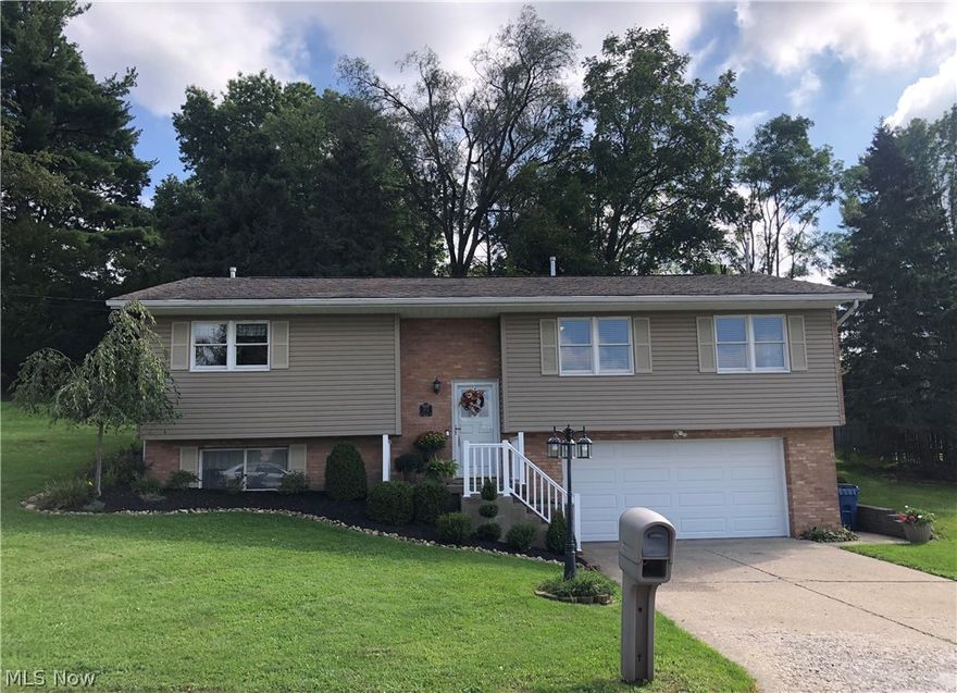 Meticulous, move in ready, with updates and curb appeal in a great neighborhood and close to schools, downtown, malls and interstate if needed.  This 3 bedroom 2.5 bath home has newer neutral paint, window coverings,  flooring and great natural light in the rooms.  Cozy living room has access to your kitchen and also dining room.  The kitchen is spacious, has nice counter area and loads of cabinets and a plus it is also an eat in kitchen.  Access from the kitchen to the dining area is perfect for gatherings and also allows you to head out to the large rear patio area for additional entertaining, relaxing. Master bedroom with bath and additional 2 bedrooms and full bath complete your first floor.  The lower level has a nice size recreation room with gas fireplace.  Laundry room including the washer and dryer, nice size 1/2 bath and spacious storage area, lower level walks out to the oversized 2 car garage. Home warranty!  Make this home your own soon!