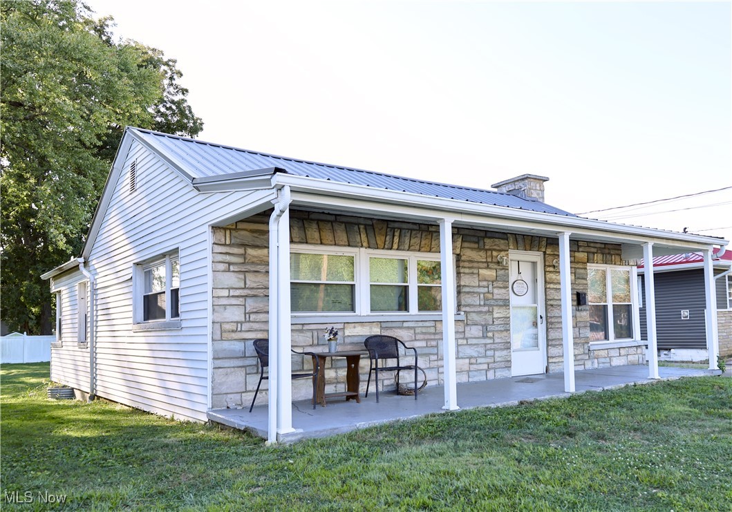 Nice Ranch home in Belpre with a Large Covered Front Porch, Detached Garage & a Very Large Level Backyard. Entering the home is the 26x14 Living Room with an area for a small Dining Table, there are 2 Bedrooms on the main level which are 14x13 & 15x10, a Full Bath & a Galley Style Kitchen. Hardwood Floors throughout the Main Level except for the LVT in the Kitchen & Bath. The Full Unfinished Basement has endless possibilities for what you might need. There is a driveway & detached Garage for parking & the Backyard is just Beautiful. You can also sneak a peak of the River from the front yard. This Charming Home just needs your personal touches.