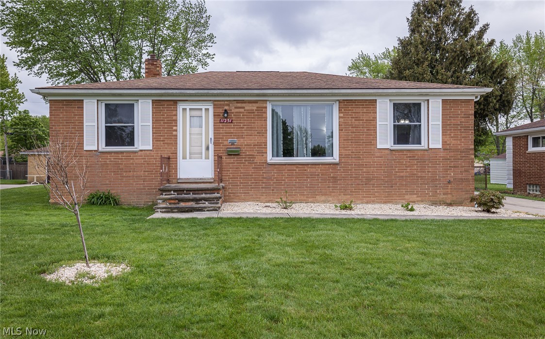 Welcome home to this charming 3 bedroom, 1.5 bath Ranch, situated on a quiet Parma street. The exterior showcases a full brick façade, Roof(2010), new driveway and garage floor(2011), easy maintenance landscaping, 2 car detached garage, fenced in backyard w/fire pit & garden area! Inside you will take notice of the hardwood floors that are found throughout the large living room, conjoined dining room and all 3 comfortable bedrooms! The kitchen supplies ample cabinetry, included appliances: Stainless steel stove, microwave & dishwasher(2017), disposal(2020) & a cozy dining area. The nicely updated full bathroom(2020) completes the main level. You will love spending time in the 3 season enclosed porch or downstairs in the partially finished basement w/ sprawling recreation room w/ convenient half bath, separate laundry & storage rooms. Furnace & A/C(2009); Hot Water Tank(2019) & 1 year home warranty included. Call today to schedule a private showing!