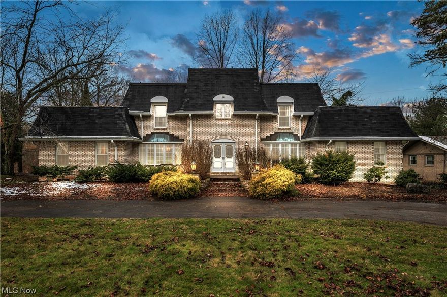 Expansive & Luxurious Estate...(6,392 above grade & 3196 sq feet below grade finished bsmt) Custom 6 bedroom, 5.5 bath full brick colonial (1st floor bedroom/full bath if needed) w/massive finished basement, 2 fireplaces, custom curved staircase, fantastic oversized side load 3 car, deep setback w/circular drive situated on a quiet country style 1.43 acre lot, all at an affordable price & immediate occupancy available...Ultimate Family Estate! Impressive interior w/all the gathering rooms including formal dining, living, family, parlor & possible library/piano room...very smart & one of a kind design including dramatic curved staircase that will greet guest at the grand front door. Kitchen includes walls of cabinet/counter space that will delight any cook. Sunken massive family rm & light filled parlor (perfect 1st flr library/den) both w/warming brick fireplaces. 2 additional elegant rooms to be used as you wish. 1st flr bdrm/full bath for in-laws. Private oversized owner's suite w/2 walk in closets, dual sinks in bath & makeup vanity sink. 2nd flr includes laundry w/cabinet/tub/counter space & 5 bdrms all w/direct access to a full bath Jack n Jill). Full finished basement w/endless possibilities. Tennis/basketball court in back yard. Priced below market value/cosmetic updates needed...home has  been cared for but not remodeled much since original construction.