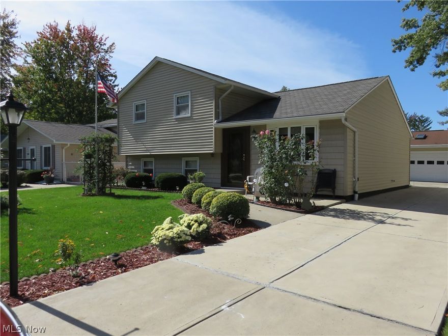 Beautifully updated in and out, with quality amenities and upgrades galore, this gorgeous home takes pride of ownership to a whole new level!  These original owners have spared no expense in making it a showplace!  Dream garage 30x24 (1998), 3-car wide, with a 2-car door, great as a workshop/hobby area, insulated w/ heat & a/c, 2 skylights, oversized parking pad!  This outstanding home boasts a brand new roof (Aug 2016) w/50-yr transferable warranty, new gutters and gutter covers (2016), new exterior Anderson doors (2016), new windows (2005), new vinyl siding & insulation (2002), central air (2009).  The living room and dining area offer rich Bruce hardwood floors and the kitchen shines with refaced cabinetry (2000), microwave (2014), dishwasher (2013).  New interior doors (2016), new laminate floors and carpet (2016).  The upstairs bath was remodeled (2000) w/ custom Rebath tub and surround, vanity cabinet, toilet, and the lower bath was given a new vanity and toilet.  The family room