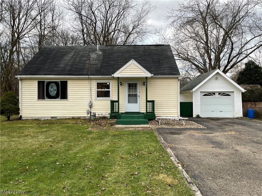 This home offers great affordability in the City of Green and close to everything in the Portage Lakes! Huge updated and fully applianced kitchen features plenty of cabinets, a moveable island, and a breakfast bar that leads into the Dining/Great room area. There is a first floor bedroom and two large bedrooms upstairs (one is tandem). The basement has a finished rec room and also a unique finished "crawl" area (not included in the lower square footage) that will be a favorite place for the kids! The garage is almost large enough for two cars and will be good for storage or possibly a future work shop. The well and septic have been regularly maintained and updated as needed.