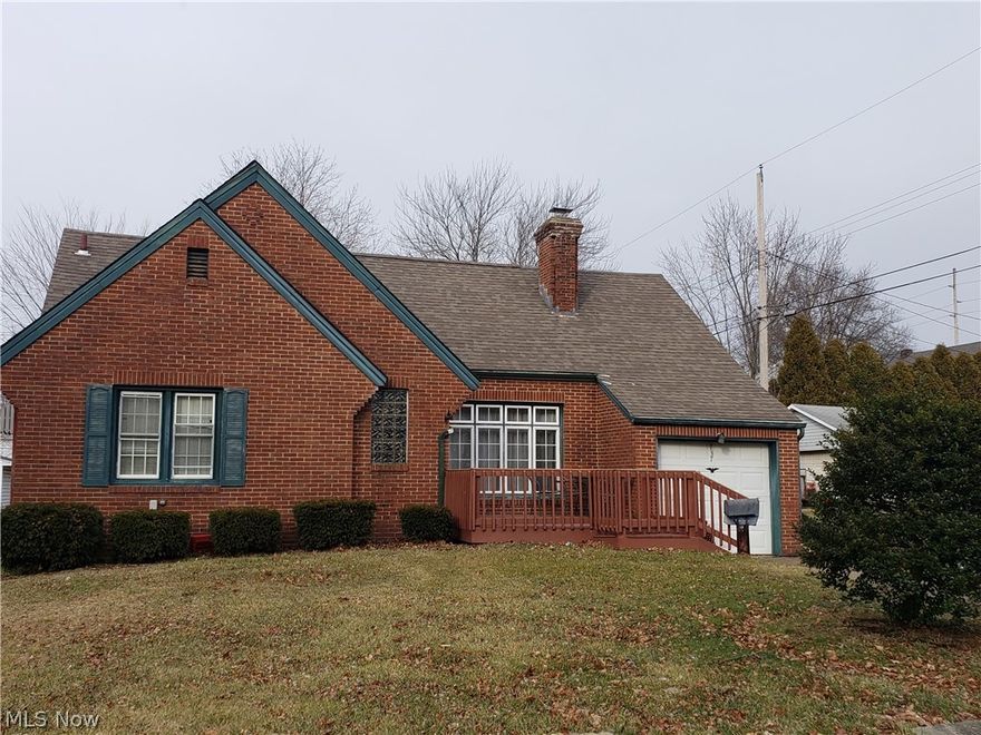 This all brick bungalow overflows with living space.  As you enter you will find hardwood floors throughout. The living room features fireplace and picture window, dining room with french doors open to 3 season sunroom that looks out to a huge back yard. Across the street (back of home) you also have a huge 3 car detached garage, a mechanics, boaters, motorcycle, RV, crafters dream. The potentials are endless.  Back inside, the basement has partially finished living space, with bar area. Upstairs features bedroom, adjoining to another room, and a huge closet. This home has much potential.