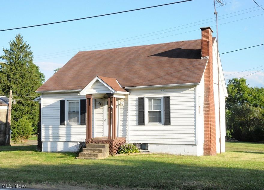 Cape Cod featuring 3 bedrooms including a first floor master. Located in East Muskingum SD. Full walkout basement and nice level yard. Huge building that would hold up to eight vehicles. Home has septic and well.