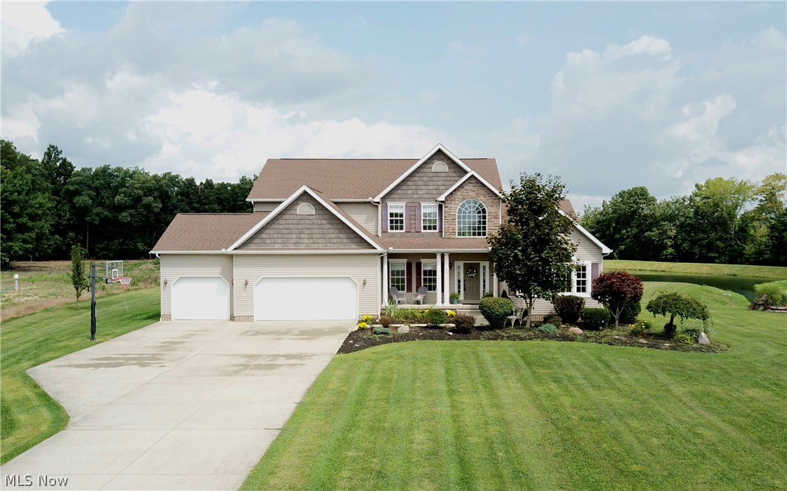 Welcome to 5417 Ledge Rock, a 4 bed/ 3.5 bath custom built home in Rootstown! Enter into the foyer that opens up into a two story great room with a fireplace and gorgeous views of the deck and backyard. The open floor plan main floor then leads into a fully applianced kitchen and a sunroom with access to the spacious deck and hot tub. The first floor owner’s suite includes a bathroom with a large tub and access to the deck. Upstairs you will find a loft area and the remaining 3 bedrooms and 2 bathrooms. Backyard also includes a gazebo, stocked pond, and dock. 3 car garage and full basement with ample storage room. New kitchen flooring, backsplash, and granite countertops 2018. New carpet throughout 2018. Neighboring empty lot second parcel also included. Don’t miss out. Schedule your private tour today!