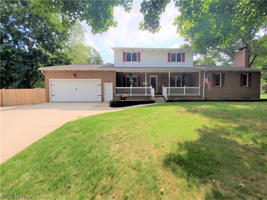 Welcome to 207 Munroe Falls Avenue, an impressive 5-bedroom, 4-bathroom home in Munroe Falls! This home has an incredible number of features and updates throughout both the interior and exterior! Huge eat-in kitchen has Quartz countertop and an oversized island. Under and over kitchen cabinet LED strip lighting hard-wired into the wall light switches. All Whirlpool kitchen appliances included (new in 2018). Spacious living room has floating wall-mounted entertainment center, a lovely brick fireplace, dual ceiling fans, and cordless light filtering Bali pull-down shades (shades are throughout entire first floor). Built-in mudroom lockers/cubbies with shoe storage drawers and bench. Enormous main-level Master’s Suite – Master bathroom was remodeled in 2020 and features an incredible clawfoot double slipper case iron bathtub. Four large bedrooms located upstairs.  This home has a four-car drive-thru garage (rear and front double lift doors) with heat, water, and a huge workbench. Chamberl