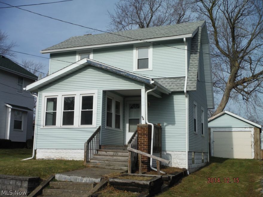 Vinyl sided 2 bedroom home with detached garage.  Partially fenced backyard.  Needs some TLC, being sold AS IS.   Appears to have some updated windows and glass block in the basement.