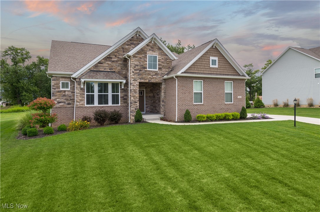 Welcome to 1343 Skyland Falls Boulevard in picturesque Hinckley—a haven of comfort and style. This captivating 3-bedroom, 2.5-bathroom home offers a sprawling 3,922 sqft of thoughtfully designed space perfect for those who cherish a blend of luxury and practicality. Step inside to discover an inviting open floor plan that seamlessly integrates living spaces. The great room is a highlight, featuring a striking stone gas fireplace and plush carpeting, ideal for cozy family gatherings. The modern eat-in kitchen is a chef's delight, adorned with sleek white cabinets, stainless steel appliances including a countertop range, and a generous island that doubles as a breakfast bar. Entertain effortlessly as this space flows naturally to other living areas. The primary suite is your private retreat, boasting a lavish bathroom equipped with double vanities, a walk-in tile shower, and a separate toilet room. A second bedroom enjoys the luxury of its own private bath, while an additional bedroom and a half bathroom complete the main level. Convenience is at your fingertips with a main-level laundry room and ample storage. The fully finished basement offers endless possibilities with a large rec room covered in soft carpet, ensuring entertainment for all ages or a peaceful escape for hobbies and relaxation. A 3-car attached garage provides expansive storage and parking solutions. Outside, the 12x15 covered patio invites alfresco dining or evening relaxation, overlooking a lush, expansive grass yard ideal for outdoor activities and gardening alike. Nestled in a tranquil setting, this residence is ready to become your forever home. To experience its charm firsthand, schedule a viewing today. Contact us to see how 1343 Skyland Falls Boulevard can perfectly complement your lifestyle.