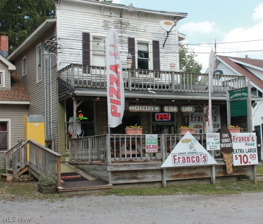 Great storefront property with 3 apartments. Store front currently a pizza parlor and 2 of the apartments are occupied. Upgrades! Newer mechanics, electrical (separate meters for each apartment) newer plumbing, siding, insulation, roof and newer maintained septic. Storefront includes:equipment, ice cream machine (needs TLC) pizza oven, registers, coolers, freezers, stove & refrigerator. Also surveillance cameras, offering carry out liquor license and vendor service license to sell groceries.