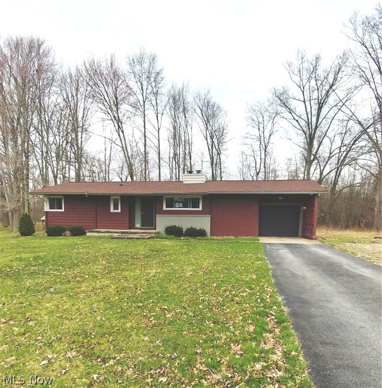Wooded seclusion describes the location of this totally updated Ranch home tucked away as the last house on a dead end street surrounded by woods. Beautiful wood floors throughout. Great room with wood burning Fireplace has an oversized window looking out to the wooded back yard and an eating area with serving window to the Kitchen. From the Great Room, you can also step outside to the covered back patio and take in the beauty of nature. Updated Kitchen has stainless dishwasher, stove top and oven. Updated bath. Bedrooms have nice wood floors. Large, clean basement with washer and 2 dryers. Newer high efficiency furnace, AC, HWT, updated electric and New roof with architectural shingles in 2014. Sewer to be installed at the road this year.