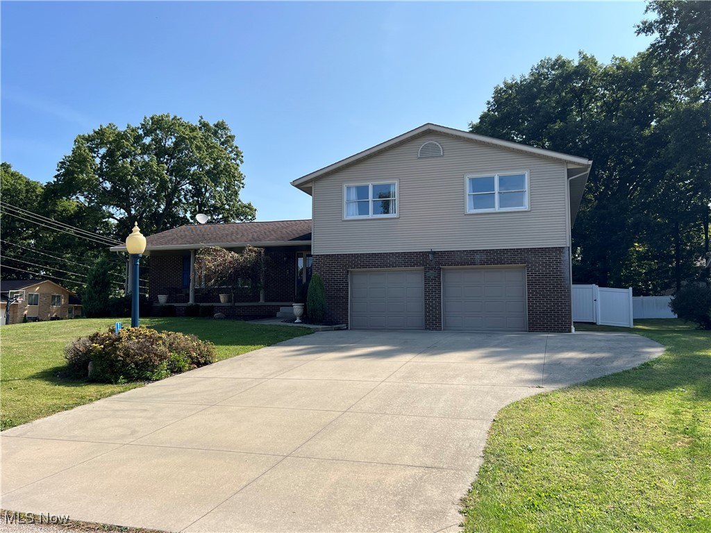Wow! It's what you'll say when you enter this not so typical 4-level split in a super convenient NW Perry Twp location, Plymouth Knolls. More than 2,900 square feet of living space in this 4 bedroom, 2.5 bath home that has been fully updated throughout and has a private fenced-in flat backyard with walkout patio from family room and walkout composite deck from the dinette along with a large shed/barn with electric. A welcoming covered front porch greets you and leads to the large tiled entrance foyer where you'll also find a spacious living room and dining room with beautiful Brazilian teak hardwood floors. The remodeled eat-in kitchen has loads of cherry cabinets along with granite counters, amazing lighting, tile floors and newer stainless steel appliances along with an induction cooktop. Up the hardwood steps you will find 4 large bedrooms including a master with oak hardwood floor and a private bathroom and a double closet and a bright hallway full bath with sun-tunnel/solar tube. The lower level includes an amazing family room with a gas fireplace with remote, beamed ceiling, built-ins, ceiling fan and easy access to a new half bath, 2-garage entrances and to the basement where you'll find the laundry room and loads of storage. Other features and updates include: Newer furnace & AC (6-8 years); hot water tank (2021); oversized 2-car garage with 2 separate doors; glass block basement windows; washer and dryer included; quality updates and remodeling throughout. Don't miss your opportunity!