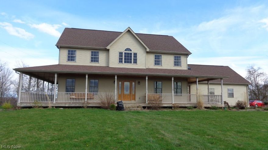 This is an awesome 2 story home with an open floorplan sitting on 5 acres in the country including a 48 x 24 pole barn.  The eat in kitchen has everything a chef would desire..granite countertops with hickory cabinets, large island with barstools, a corner desk,  3 pantry cabinets, and all appliances.    Features 3 bedrooms, 2.5 baths, huge closets, and 3rd full bath and 4th bedroom in the partially finished basement with tung and groove knotty pine walls  The home has a wrap around covered porch with manufactured Timbertech decking and vinyl handrails.  This beauty also has 3/4 inch oak planking floors and features 5 foot wide hallways and 4 ft. wide steps.  Stairway leading to basement has mangaris wood steps which won't warp, twist, or rot . Home features a 200 lb. propane tank to heat finished garage with access door to basement.  Don't miss the opportunity to show as it's one of the best built homes around with alot of thought going into the layout and design.