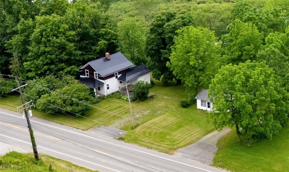 Welcome to this unique 2 residence opportunity, set on two parcels totaling 5 acres and backed up against serene wetlands rich with wildlife. 17092 and 17094 Munn. This property includes a 4-bedroom, 1-bathroom farmhouse and a separate 2-bedroom, 1-bathroom rental currently tenant-occupied.
The main farmhouse has good bones with several recent updates, including a new metal roof, a newer furnace, and an updated hot water tank. Interior improvements are needed, including paint, flooring, a kitchen remodel, and dining room updates on the first floor. The second floor will require new flooring, paint, some drywall repairs, and a bathroom remodel.
This property combines rural charm, investment potential, and the chance to restore a home to its full potential.