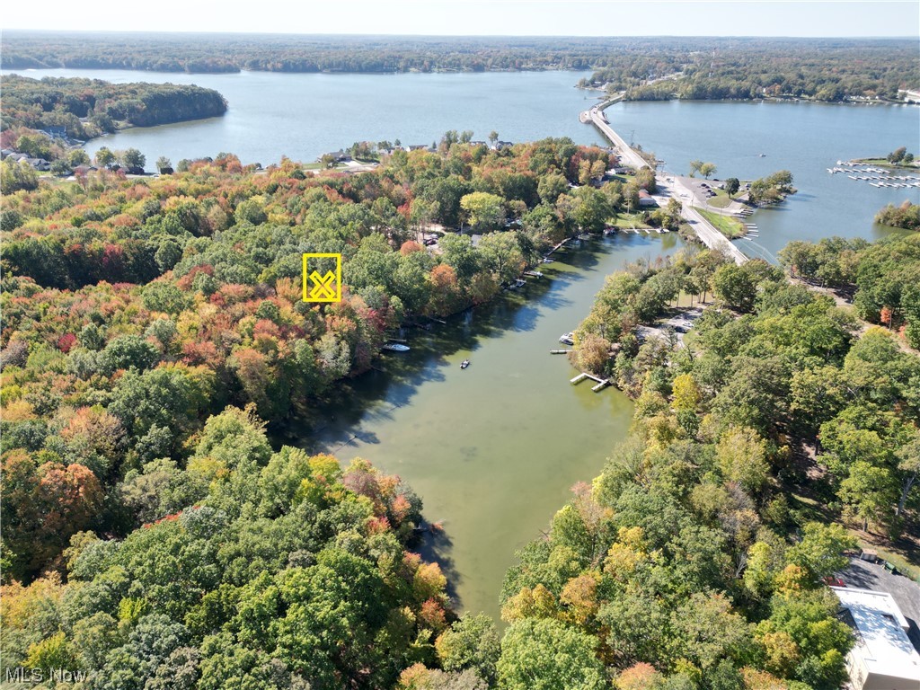 Lake front lot with Dock!! Great Location at a dead end street for this 50 x 120 ft. lot that is mostly wooded!! All city utilities at the street, no wake zone bay perfect for paddleboards and kayaks, close to multiple boat ramps, Great building opportunity!! Call today to walk the land!! Lake Milton, Ohio’s 72nd State Park. Amphitheater, beach, swimming, fishing, boating, walking and jogging trails plus golf, wineries and​​‌​​​​‌​‌​​​‌‌​​​‌‌‌​​‌​​‌‌​​​​ shopping!!