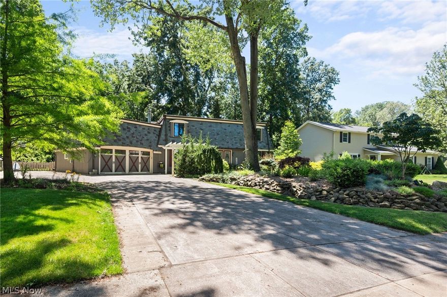 Welcome home to this absolutely stunning colonial located minutes away from Lake Erie! This home is truly one of a kind and has so much character inside and out! Welcoming front entryway featuring a paver patio, courtyard and pergola. Walk in to be greeted with loads of natural light and and open concept floor plan. Off to the right you have a cosy den, home office or formal living space featuring high ceilings, crown molding and luxury flooring. Eat-in kitchen provides upgraded cabinetry, quartz counters, stainless appliances, coffee bar, crown molding, dining space and a garden box window overlooking the backyard. Living area features hardwood flooring, beamed ceiling, skylight, wood burning stove with stone accents and built in shelving. Formal dining room boasts a wood burning stove, crown molding and room for a large table! Off the kitchen you will find a sun room with vaulted ceilings and ceiling fans. Rounding off the 1st floor is an updated 1/2 bath and laundry room! Traveling up your curved staircase you will come across 3 generously sized bedrooms including the owner suite! Owners suite boasts high ceilings, custom barn door features, walk in closet and an en-suite bathroom featuring floor to ceiling title shower, dual granite vanity, storage & more. Other bedrooms are a very good size and offer ample closet space. 2nd full bath has been fully updated featuring a tile surround, and a double granite vanity. Downstairs you will find a fully finished basement that is perfect for entertaining or relaxing! Out back you will find a peaceful and private yard. Stamped concrete patio, mature landscaping, fruit trees, and fenced in backyard. 2 car attached garage is very spacious! Come view this home to see all the wonderful updates! Conveniently located close to the lake, shopping, restaurants, highways and more! Do not pass this opportunity up and schedule a tour today!!