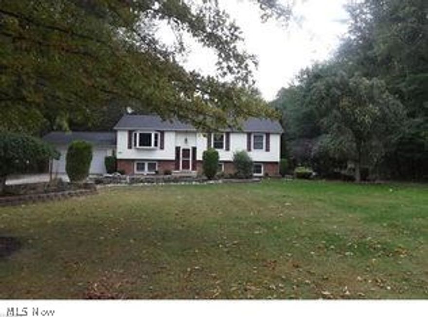 Fantastic Bi-Level Home! Beautifully landscaped complete with large deck off main floor that overlooks a stocked spring fed pond and an in ground swimming pool (18X36). In addition to the gazebo, playground, fire pit area and a storage shed all on an acre lot. If that doesn’t satisfy your outdoor craving this home comes with membership to the park at the end of the road with boat launch onto Lake Erie! The interior of this home is awesome too! It has two gas fireplaces (one on each floor) to warm the Spacious Open floor plan with vaulted ceilings. A Walk-Out lower level with an In-law Suite complete with an additional eat in kitchen. All appliances stay including the washer/dryer and both sets of kitchen appliances! An Absolute MUST SEE……Call today to schedule your private tour!