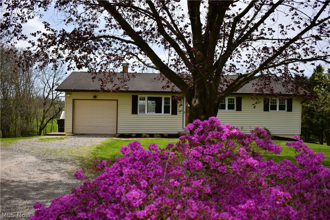 This sweet ranch offers updated windows, large tyvek deck, newer appliances, partially finished walk out basement with wood burner, tile floors, party bar and 2nd bathroom area. An absolutely beautiful back yard with a nice tree line for privacy. Laundry hook up on main and basement level.