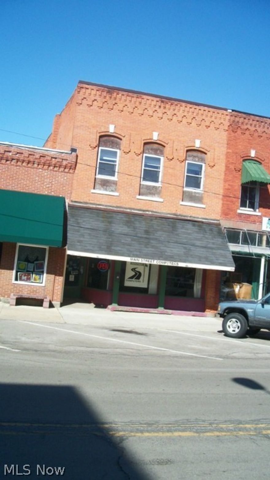Retail storefront with storage area in back, full basement & 2nd story apartment