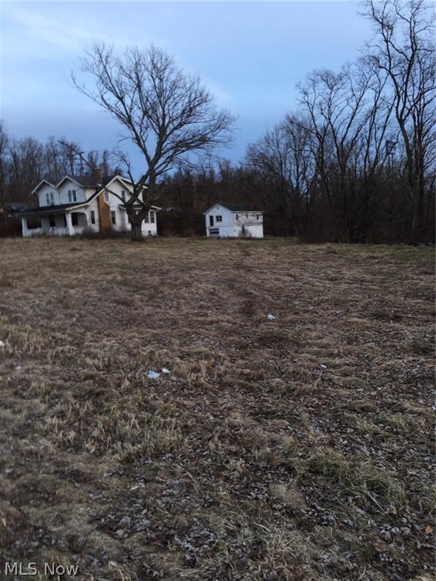 Outstanding Commercial Location!  High Traffic Area Surrounding By Restaurants, Motels, Medical Facilities and Sporting Facility....Situated on US 40 which is main artery through the area..... All utilities available Gas, Electric, Water and Sewer  Absolutely No Restrictions!  Extremely Level Lot Easy to Develop!