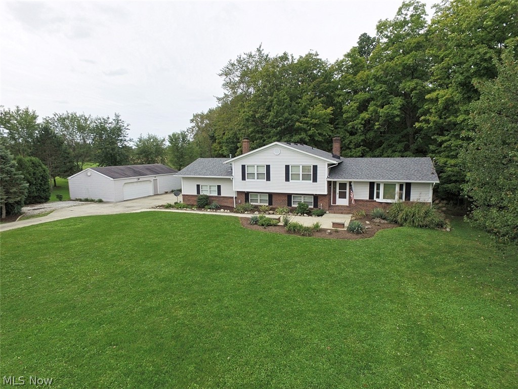 Welcome to this private very scenic move in ready home. Located in York township you won't have to worry about income tax. This home offers a 24x40 outbuilding and a heated garage. You'll find yourself enjoying the large two tier deck that overlooks the backyard and woods. Going into the home you'll find an open concept with two family rooms and large kitchen that features a breakfast bar. Master bedroom has a large closet and a master bath. The home has
always been well taken care which shows when viewing the home. Home warranty is being provided. Schedule a showing today!