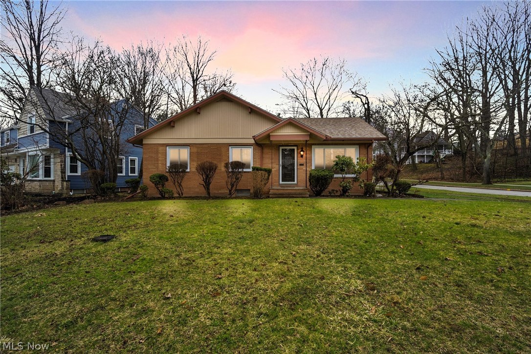 First floor living at it's finest in this mid-century brick ranch. Located on a scenic corner lot, this 3 bedroom charmer is ready for its new owner. Completely updated kitchen with brand new stainless appliances, new cabinetry, solid surface counters, and desk seat is the perfect place for family meals and gatherings. Off the kitchen, there's a half bath and a bonus room/den with sliding doors to the patio is the solution to your office/library needs. Hardwood floors throughout the large living room, dining room, and all three bedrooms. Beautiful full bath with double sinks and tiled tub/shower. Basement is finished with brand new flooring and original mid-century bar for entertaining. Nice sized fenced in yard with brick patio will be ideal in the summer months for barbecues and relaxing. Parks, shopping, universities nearby. Brand new windows and interior doors. Roof on Main house is 2011, roof on garage is 2021. HVAC 2020.