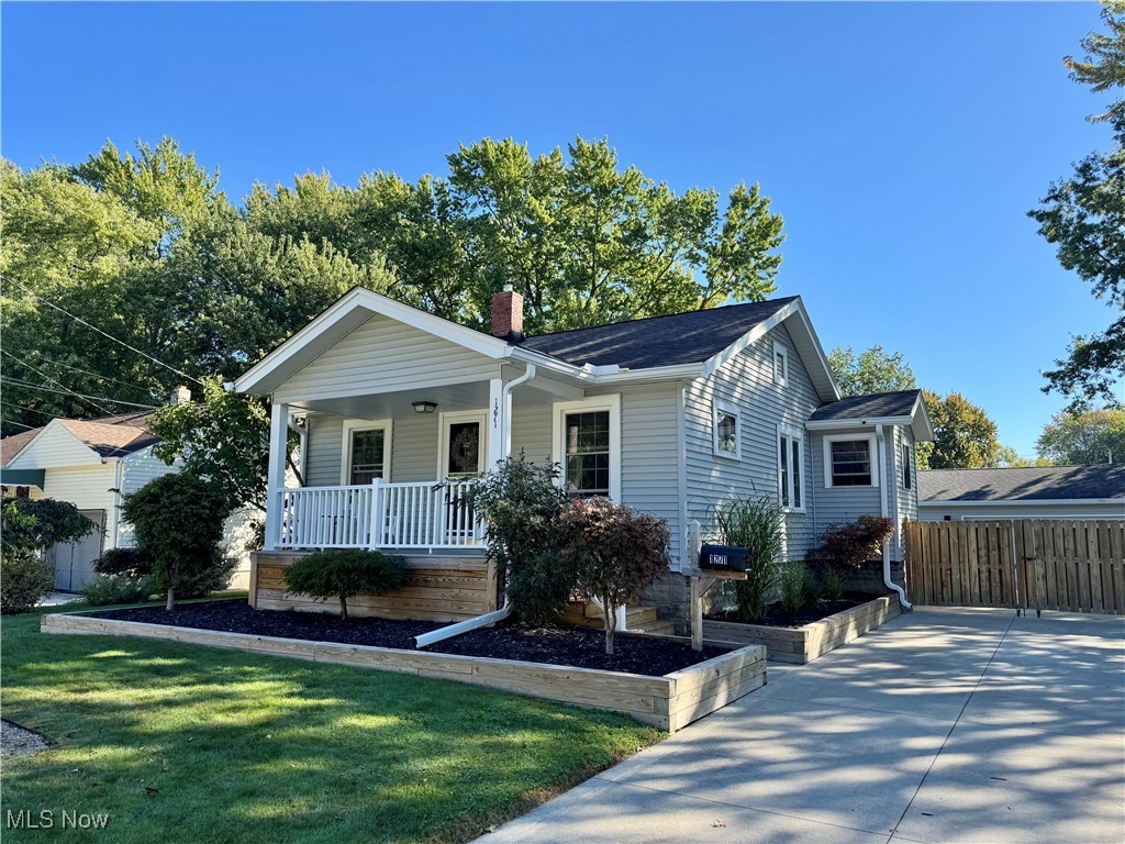 Step onto the inviting front porch and into a thoughtfully updated home featuring fresh paint, updated fixtures, and a bright living and dining area with a cozy sitting nook. The kitchen offers ample cabinet space, a wall of pantries, granite countertops, a white tile backsplash, and a farmhouse sink. Major updates include a new furnace (2024), and a roof, air conditioner and hot water tank all within the last three years. The backyard is designed for comfort and relaxation, with a covered patio perfect for gatherings and a newer hot tub under a pergola. The oversized garage offers great flexibility, including RV electrical hook-up, and the newer driveway provides plenty of parking both in front of and behind the privacy fence. This incredibly maintained home offers a great blend of function, style, and value.