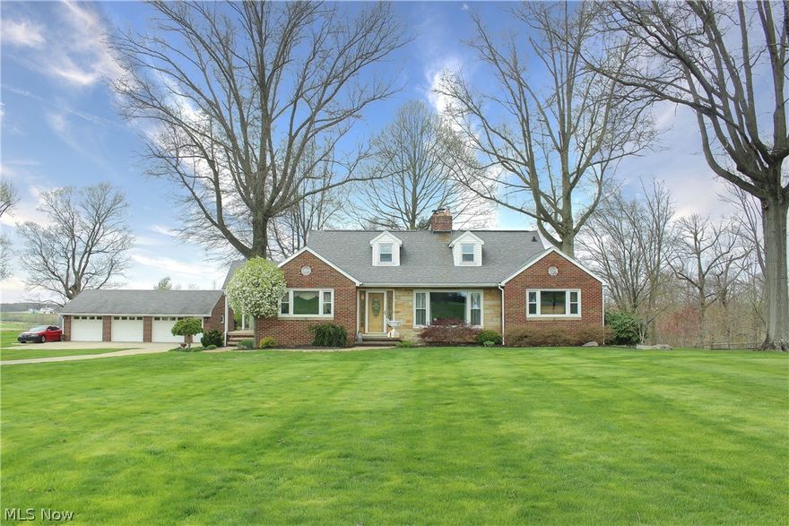 Welcome home! This absolutely stunning four-bedroom, two full bathroom is completely remodeled! Enjoy country living to a short distance to all the main amenities of town!  All brick home and three car detached garage with a great paved driveway! Living room is stunning with huge picture window with and a gorgeous all stone wood burning fireplace! Owner's currently heat the home with the wood burner in basement in winter! Updated gorgeous bathrooms and a beautiful four seasons room with nature stone floor! Office is adorable and can be used as a fourth bedroom! Many updates listed on a sheet that will be left in home for your review! New aerator septic system installed in 2012! Well water expansion tank installed in 2011! All you have to do is move in! Schedule your showing today!