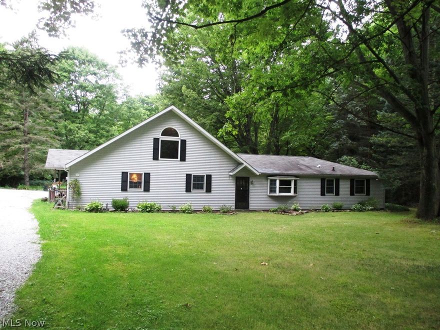 Welcome home to a serene setting on 5+ acres. This home has 4 bedrooms and 2.5 baths with a great open floor concept. Beautiful wood floors, beams and handrail. Kitchen includes updated cabinets and is fully equipped with all appliances. Jetted Jacuzzi. Large loft area with sky light overlooks great room and family room. (Note: County records do not show second floor loft area with over 480 square feet.) New septic system is being installed. There's also a 2-car detached garage, a 24x13 steel barn and an extra shed for all your garden and yard equipment.