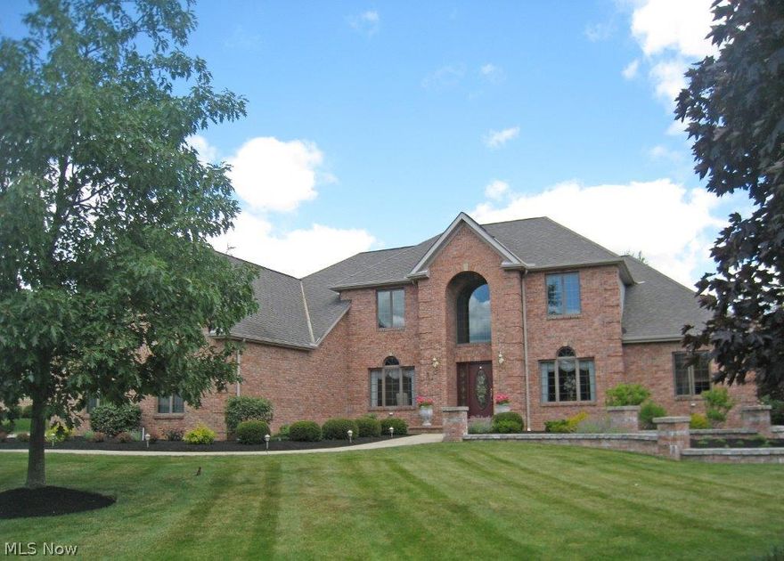 Magnificent 4 bedroom, 4.1 bath colonial with a 1st floor master suite & a 4-car garage. The 2-story, wood foyer opens to the dining room with wood flooring, and a formal living room with double crown molding. The foyer leads to the Great room with a built-in entertainment center, 2-story, wood fireplace, and deep windows. The kitchen is a gourmet's delight featuring Corian countertops, double ovens, cherry flooring, an island, Amish-built cherry cabinets, a backsplash, all appliances, and opens to the spacious morning room. The master suite has a vaulted ceiling, 2 walk-in closets, and a stunning glamour ba. with a corner Jacuzzi & double sinks. The 2nd level offers a loft area, 2 bedrooms connected by a Jack n' Jill bath, and a 3rd bd. with its own bath. The lower level features a family rm, theatre room, full kitchen, and a walk-out to the garage. Completing this offering is a privately fenced yard, a deck, heated garage, & a newly installed furnace in 2013.