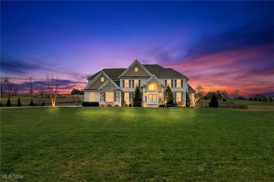 Welcome to 442 Madison Trail, a stunning home where comfort and character come together on a beautiful 2 acre lot. This spacious 5 bedroom, 4 bathroom home offers style and functionality throughout. The inviting entry features a grand staircase and a convenient half bath. A flexible sitting room sits just off the entry, perfect for a study or playroom, with an adjacent office featuring sliding barn doors that blends modern and farmhouse style and could be converted into a first floor primary suite if desired. The formal dining room overlooks the front yard and connects to a hallway with ample storage, a mudroom, walk in pantry, laundry room, and access to the oversized three car garage. The heart of the home is the impressive kitchen with a massive center island, ideal for entertaining, which opens seamlessly to the dining and living areas anchored by a cozy gas fireplace. Upstairs offers five spacious bedrooms and three full bathrooms. The primary suite is a true retreat with a soaking tub, oversized shower, double sinks, hidden toilet, and a large walk in closet. One bedroom functions as a second primary suite with its own full bath and walk in closet, while the remaining bedrooms also feature walk in closets. Outside, enjoy a fully fenced backyard with wrought iron fencing, a wooden bridge with electric, an enclosed raised garden, and a shed with water and electric. A concrete patio provides the perfect space to relax or entertain. With a partially finished basement, EV charger, great neighborhood, and excellent school district, this home truly has it all. Reach out for additional photos, video & floor plans. Call to schedule your showing today!