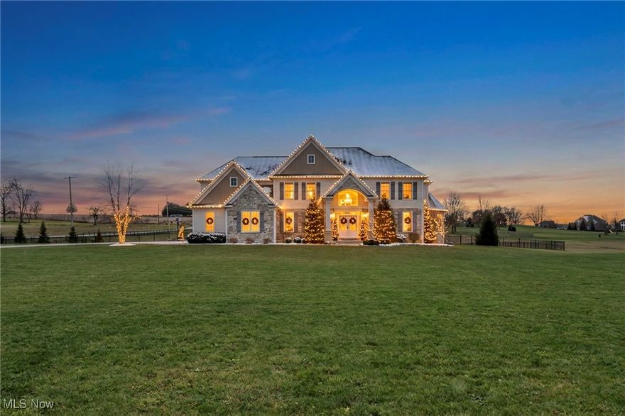 Welcome to 442 Madison Trail, a stunning home where comfort and character come together on a beautiful 2 acre lot. This spacious 5 bedroom, 4 bathroom home offers style and functionality throughout. The inviting entry features a grand staircase and a convenient half bath. A flexible sitting room sits just off the entry, perfect for a study or playroom, with an adjacent office featuring sliding barn doors that blends modern and farmhouse style and could be converted into a first floor primary suite if desired. The formal dining room overlooks the front yard and connects to a hallway with ample storage, a mudroom, walk in pantry, laundry room, and access to the oversized three car garage. The heart of the home is the impressive kitchen with a massive center island, ideal for entertaining, which opens seamlessly to the dining and living areas anchored by a cozy gas fireplace. Upstairs offers five spacious bedrooms and three full bathrooms. The primary suite is a true retreat with a soaking tub, oversized shower, double sinks, hidden toilet, and a large walk in closet. One bedroom functions as a second primary suite with its own full bath and walk in closet, while the remaining bedrooms also feature walk in closets. Outside, enjoy a fully fenced backyard with wrought iron fencing, a wooden bridge with electric, an enclosed raised garden, and a shed with water and electric. A concrete patio provides the perfect space to relax or entertain. With a partially finished basement, EV charger, great neighborhood, and excellent school district, this home truly has it all. Reach out for additional photos, video & floor plans. Call to schedule your showing today!