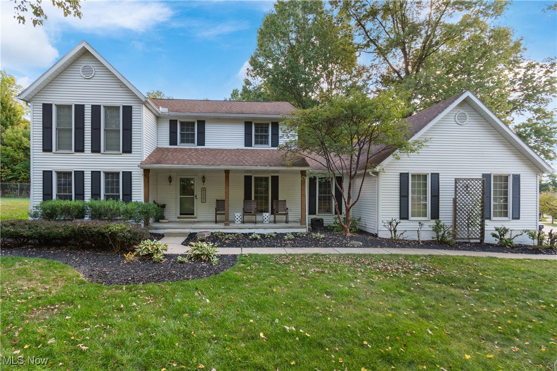 Welcome to this completely renovated 4-bedroom 2.5-bath Colonial located in the desirable Benwood neighborhood within Stow-Munroe Falls Local Schools. Over 2,600 sq.ft. of updated living space & a rare 3-car attached garage. The heart of the home is the stunning new gourmet eat-in kitchen completed in 2024. It features an impressive 11-foot quartz island w/ breakfast bar, sleek new cabinetry, tiled backsplash, farmhouse sink, custom hood vent, a walk-in pantry & black stainless steel appliances in 2019. The kitchen opens to a spacious living room w/ an updated gas brick fireplace & a new modern mantel. Nearby, a formal dining room adds a touch of elegance. The 1st floor offers a versatile bedroom currently used as an office w/ built-in features & French doors. A convenient 1st laundry added in 2022 & the half bath was also renovated the same year. Throughout the main level you'll find gorgeous waterproof LVP flooring (2023) adding durability & modern style. Upstairs the spacious primary suite is a true retreat featuring a garden tub, separate shower & double vanity. Two additional bedrooms & a full bath complete the second floor. The basement has potential for expansion w/ 2 new egress windows added in 2025 & architectural plans available to add two additional bedrooms. The home also features 200 amp electric service, mostly new windows 2020, a tankless hot water heater 2020 & ceiling high garage doors also 2020. Step outside to enjoy the inviting curb appeal & covered front porch or relax in the spacious backyard on the composite deck installed 2021 w/ black railings. An outdoor gas line was added in 2023 for convenient grilling & an underground electric dog fence was installed in 2025 for added peace of mind. A three-dimensional 35-year shingle roof installed 2012. Located close to parks, soccer fields, shopping, and restaurants, this meticulously updated home is truly move-in ready with nothing left to do but enjoy!