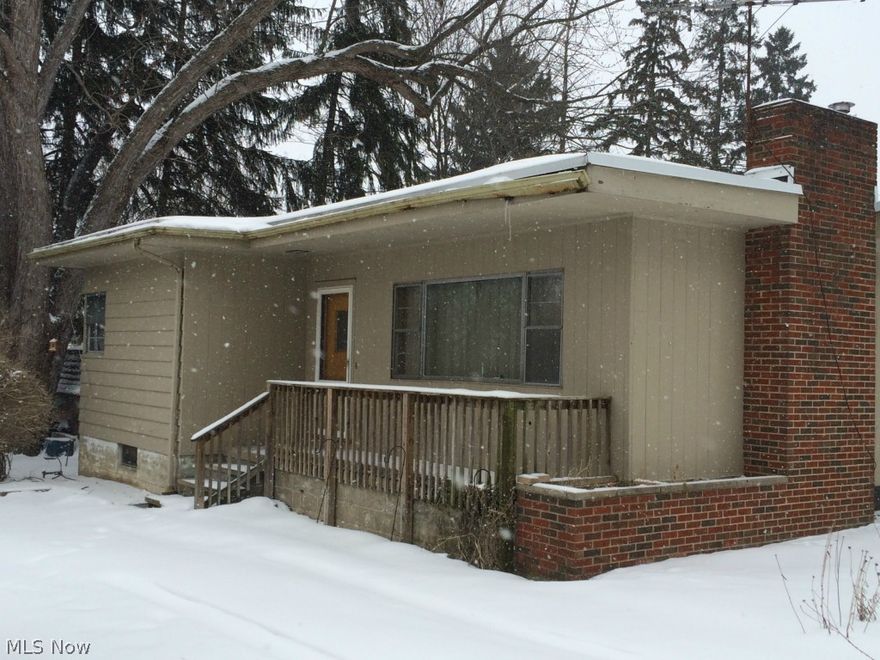 Unique Akron/Kenmore area property priced to sell!  Charming hardwood floors and built-ins. The kitchen has custom cabinets, custom wood paneling throughout. Large living room with lovely fireplace/mantle & built-in high back bench for seating.  Full basement provides plenty of usable storage space as well as potential for adding a future rec room/family room space.  Mechanicals in working condition.  Newer breaker panel.  Newer furnace.  This is a must see Kenmore property!