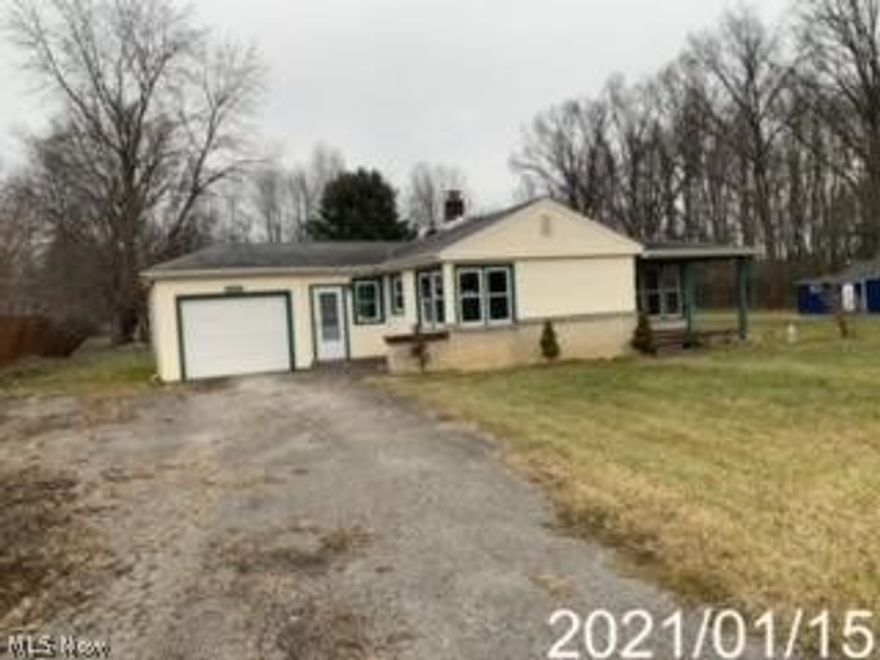 Two bedroom, one bath ranch with garage and large shed.
