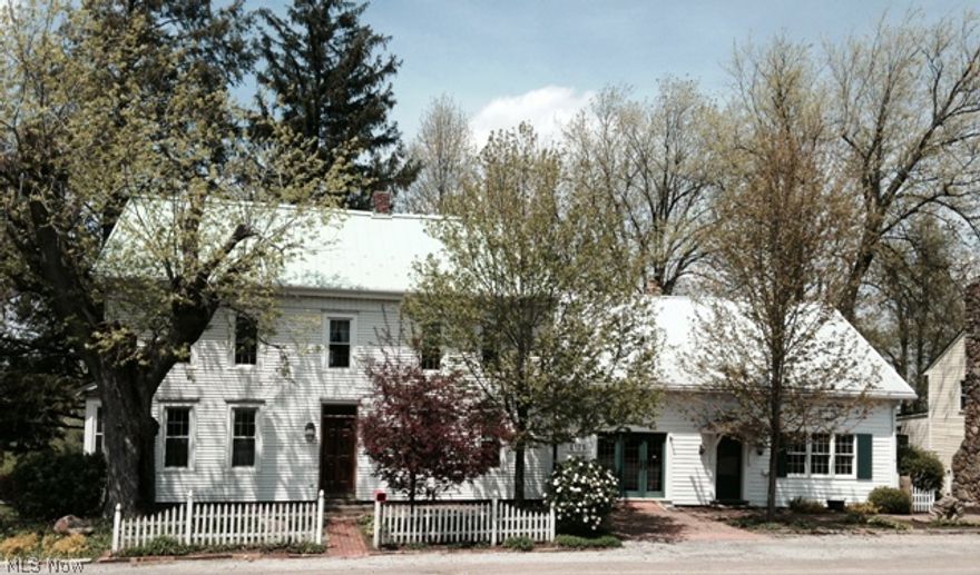 Century old charm in 1830s home w/ hand crafted construction. This remodeled 4bed 2FBath home/store front/effic. apartment has many opportunities located in Winesburg the heart of Amish Country. Enjoy the possibilities of bed/ breakfast, retail shop, wine & cheese/gift shop while guests enjoy ambiance on the patio & gardens. Sit under the grape arbor & have front row seats to ball game/park. Beautifully hand crafted stone work all around including arched walkway, bronze headed eagle w/stone winged wall! Home invites you into a grand foyer, living rm w/fireplace, formal dining rm. custom Schrock kitchen w/island. 1st fl master bed w/vanity Fbath & 1st fl lndry. 2nd lvl features 3 large bedrms & FBath, walk up attic. 1 car grge. Fll basement. Attchd store fnt includes 28x15 front studio, 27x14 retail shop ovrlking covered deck. Private 15x12 office. 2nd lvl houses fully furnished eff. apartment w/FBath, app kit/laundry area & deck to relax & enjoy the views.