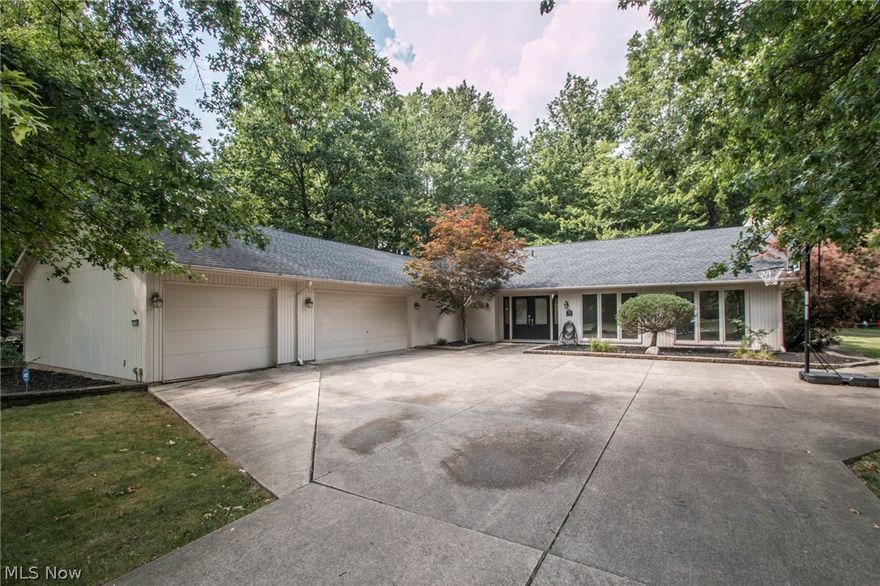 Check out this Meadowood 4 bedroom 3180 sq ft Ranch w/ open floor plan and pristine landscaping, stone framed tree beds, manicured lawn & oversized driveway w/ ample parking & turning ability. 3 car heated garage. Double front doors leading to foyer  w/ gleaming ceramic tile floors.  Formal living room and dining room enter into spacious family room w/ center wall fireplace & built-in shelves w/ storage. Kitchen w/ an abundance of cabinets, & breakfast bar w/ open viewing to the family room, with  walk in pantry and slider to deck.   A 20x16 Great room w/ vaulted ceilings  added in 2003 gives you room to relax & enjoy watching the seasons change through the wall of windows. Master bedroom w/ en-suite bath & 3 more bedrooms make the perfect spaces to retire to at the end of your busy day.  Centrally located  laundry room, separate mud room & 2 full and 0ne 1/2 baths complete the interior of this home. Backyard is fully fenced & has an amazing extra large deck located in the middle of th