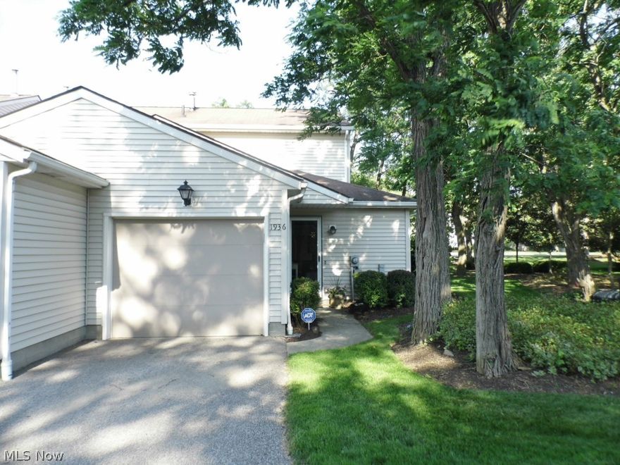 This is the Condominium you have been waiting for! End unit with gorgeous landscaping, exterior patio with fence in the highly sought after Locust Grove Condominiums on Lillian Rd and Darrow Rd in Stow Ohio. This 2 bedroom, 1.5 bathroom with 1 car garage condo is bright with great window views of mature trees and large open common space since it is at the end of the set of condominiums. There is a nice layout kitchen opens to a separate Dining Room with Window seat. Living room has a corner gas fireplace and opens to the patio surround for entertaining or relaxing. The half bath and laundry room and garage finish out the first floor level. The 2nd floor has a Full Bathroom with Tub/Shower, 2 large bedrooms (instead of 3 small bedrooms) and a linen closet. The bedrooms have ample closet storage space and 2 windows each since this is an end unit. The decorating is neutral, carpets were just professionally steam cleaned and ready for the next owner. Current owner has LOVED living here and