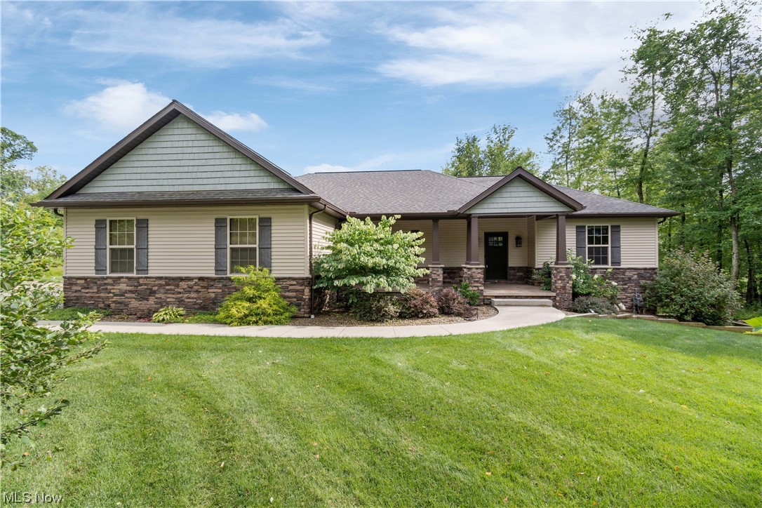 This beautiful custom built, ranch home is a must see! The large covered front porch and raised rear deck overlooks 4.57 partially wooded acres in Lexington School District. It features an open floor plan that includes a first floor mud/laundry room with built-in cabinets and drying rack. The great room has 11’ ceilings and a stone fireplace set off by beautiful natural light that fills the large open space. The kitchen has a large island and walk-in pantry. The primary suite features a fantastic bathroom with double sinks, soaking tub, tile shower and a large walk in closet. Finished walk-out basement. Landscaping recently spruced up. Large egress windows shine lots of natural light. There is a 24x24, 2 bay outbuilding.