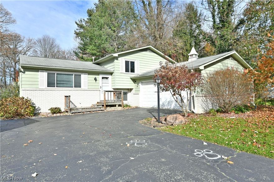 Hot on the market and ready to excite, this colorful Howland split level won’t be around for long! Take advantage of its three tiers of beautiful living space, plus an additional finished basement for even more potential. Located in a desirable neighborhood, this home provides plenty of natural privacy with its tall surrounding trees as you enjoy the sizeable back deck and included above ground pool. Inside, a sun filled living room showcases its dark hardwood styled flooring as the nearby kitchen and dining rooms look on with their tasteful updates and sleek, stone countertops that glisten under the stylish lighting. Upstairs, a handsome full bath awaits the landing as a trio of welcoming bedrooms line the hall with plush carpet and personal closet space. Down below, the lower level enjoys an ample family room along with a fourth bonus room and half bath. Laundry and storage reside at the basement level.