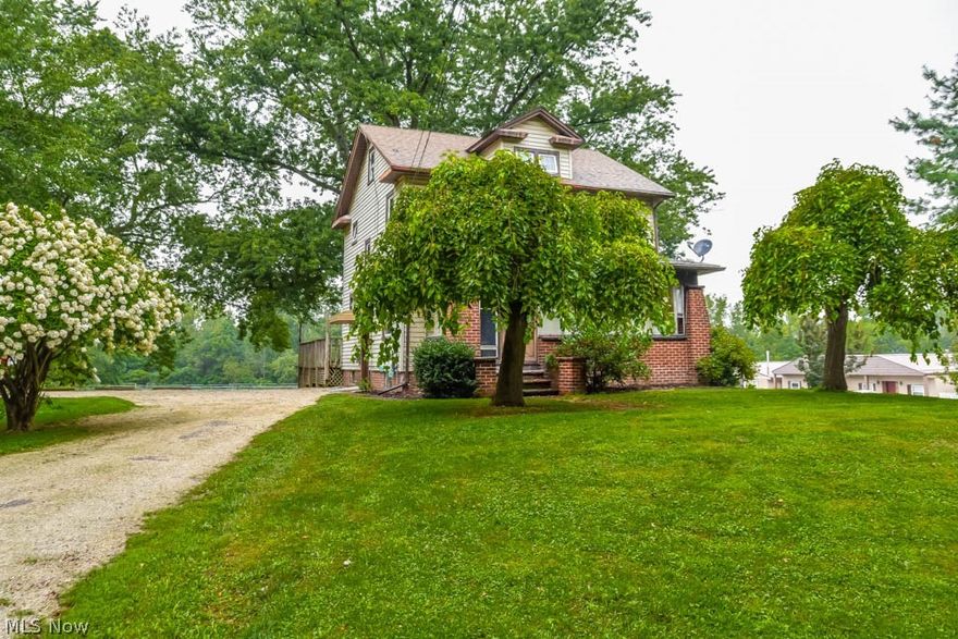 Beautiful views at this 4 bedroom, 1.5 bath colonial that backs up to a horse farm! The main level offers an enclosed front porch, a spacious living room, a dining room with large windows, wood flooring and corner hutches and an applianced kitchen with a butlers pantry and half bath around the corner. Upstairs, there are 3 bedrooms with nicely-sized closets and a full bath with tile flooring. The finished third floor allows for a fourth bedroom with a nook and deep closet. The lower level has a partially finished rec room, root cellar, storage and a new furnace (2020). Outside, there's a 28x24 back deck overlooking a nice backyard with an outbuilding. The outbuilding’s main level measures 30x24 with steps to a lower area. Ample off-street parking, too! Great location near the airport and I-77. Schedule a private showing today!