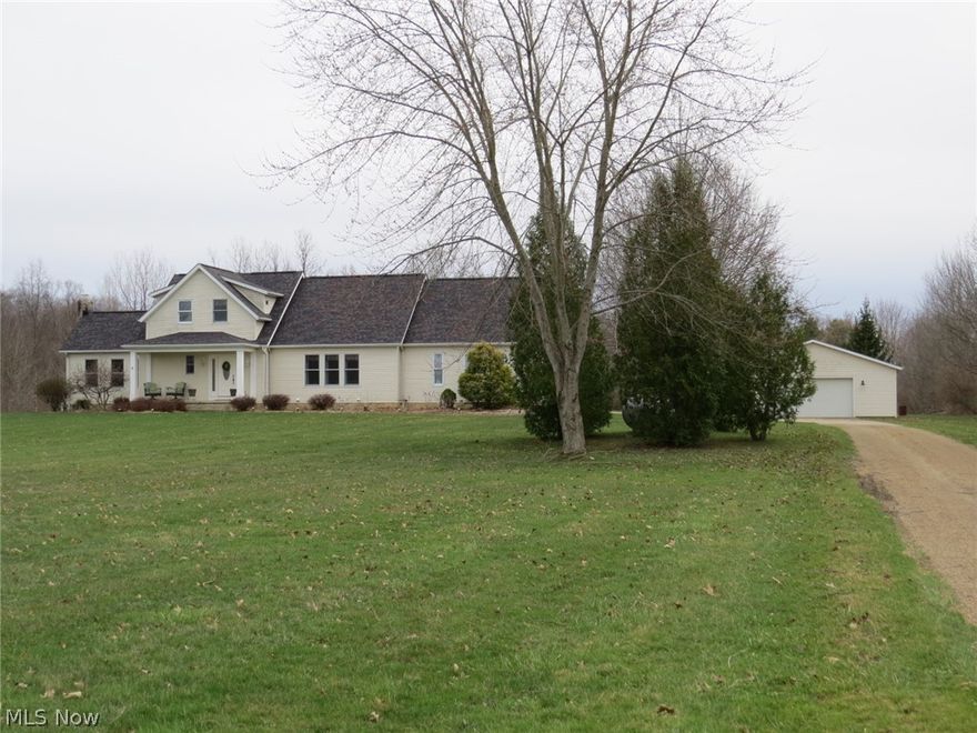 Welcome to your private retreat - where the classic charm of this cape cod meets wide-open space of 8.84 stunning acres! From the moment you drive down the driveway with a view of the front yard pond, you will start to fall in love with all this home has to offer.  The covered front porch welcomes you into the spacious entry which further leads to the open great room with fireplace, formal dining and breakfast nook area as well as a gourmet applianced kitchen with island. Just down the hall you will find the walk-in pantry, 1st floor laundry and eclectic half bath.  This home has a double staircase to the basement featuring a bench seat by the garage and a wood paneled entrance near the front door.  The basement boasts of a large finished area for a rec room, additional office space and so much more.  The basement includes an unfinished area with storage as well as a craft/hobby room.  The highlights of the bedrooms include a first floor owner's suite with a stylish walk-in closet and a beautiful bathroom with both a shower and soaking tub plus 2 bedrooms each with a study cove. Enjoy the out of doors from the sprawling covered back deck, above ground pool, 48x32 outbuilding with electric & concrete floor, place for a garden, plenty of open space, a creek and woods! Home features vaulted ceilings, hardwood floors, an updated design, heater in 2 car garage, and a new roof (October 2025)! Hurry on this one!