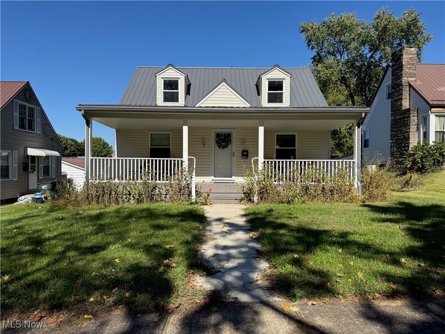 Charming Cape Cod home blending classic character with thoughtful updates! The exterior features vinyl siding, a durable metal roof, Trex front porch, new gutters, sidewalk, and replacement windows all updated in 2023. Step inside to a welcoming foyer and living room with gleaming oak floors, crown molding, and fresh neutral paint. The main floor offers full bathroom and an eat-in kitchen with solid oak cabinets, tile flooring, and convenient outside access. Upstairs, you’ll find two cozy bedrooms, a half bath, and ample storage space. The finished basement expands your living area with a warm family room featuring wainscoting, a bar area, drop ceiling, laundry area, bathroom and shower. Additional highlights include a new main stack (2023), 200-amp electric service, foam insulation, gas furnace, and hot water heater. The walk-out garage and alley access add practicality, while mature landscaping enhances curb appeal. Move-in ready comfort meets timeless Cape Cod charm!