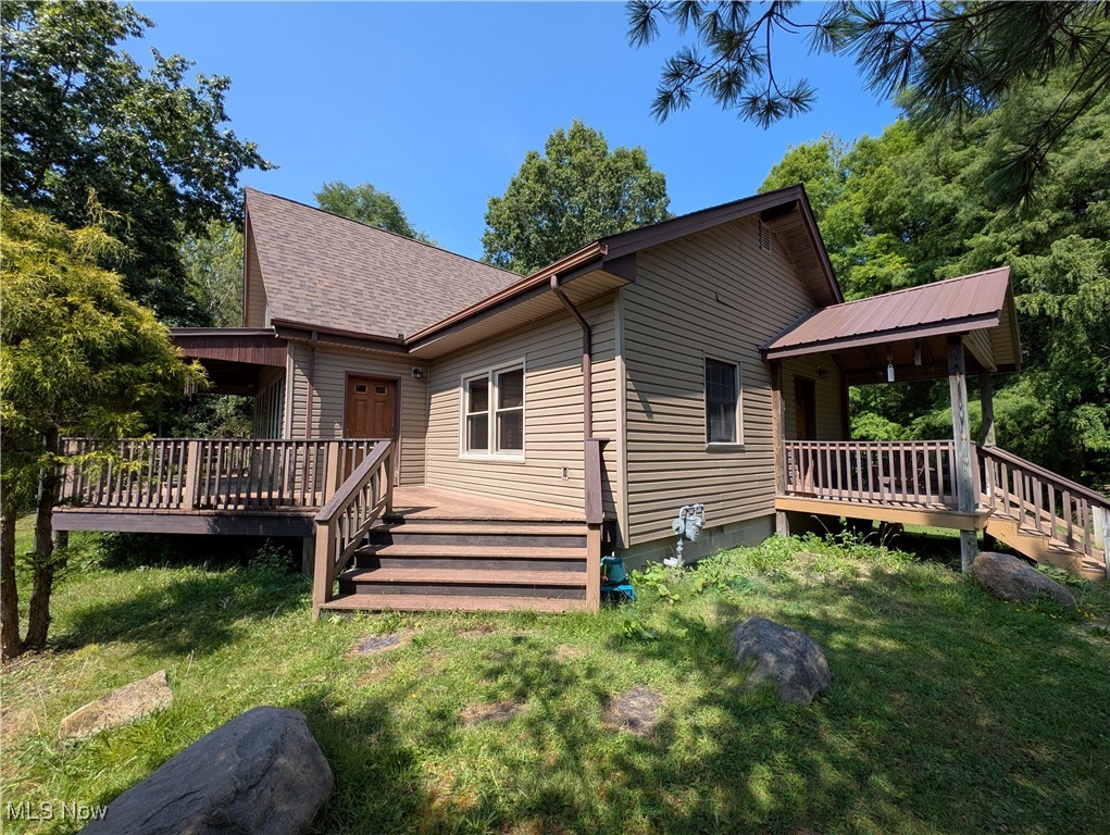 A Hunter’s Dream!! You will fall in love with this 3 bedroom 2 bath custom built home with over 1,800 sq. ft.! With just under 42 acres of mostly wooded land it highlights: over 1,200 ft of frontage, a 4 acre pond with large island, two outbuildings, a 40x22 pole building and 32x24 barn with loft and carport. The house is placed perfectly next to the pond, has a large covered porch with amazing pond views. Inside the main living room area has an open concept with vaulted beamed ceilings, and a stacked stone area with a wood burner. A Beautiful spiral staircase goes upstairs to the loft and additional bedroom. Many large windows for natural lighting. Large master suite with vaulted ceilings and walk in closet. This is a special property that is ready for your finishing touches. Call for a private showing today!!