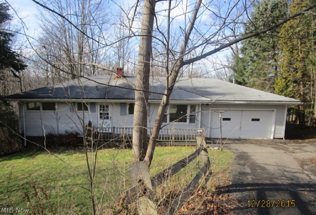 Peaceful and serene wooded views from the back of this ranch home in Hinckley. Built into an incline provides a convenient walk-out basement, partially finished as rec room with half bath, plus additional space for laundry, storage and work room. Lovely custom wood deck surrounds the entire rear of house and overlooks creek and woods. Deluxe views from the fully enclosed, all-season sun room. Eat-in kitchen. Spacious bedrooms and full bath on main floor. Highland School District. Needs some TLC, but don't miss out on this wooded gem!