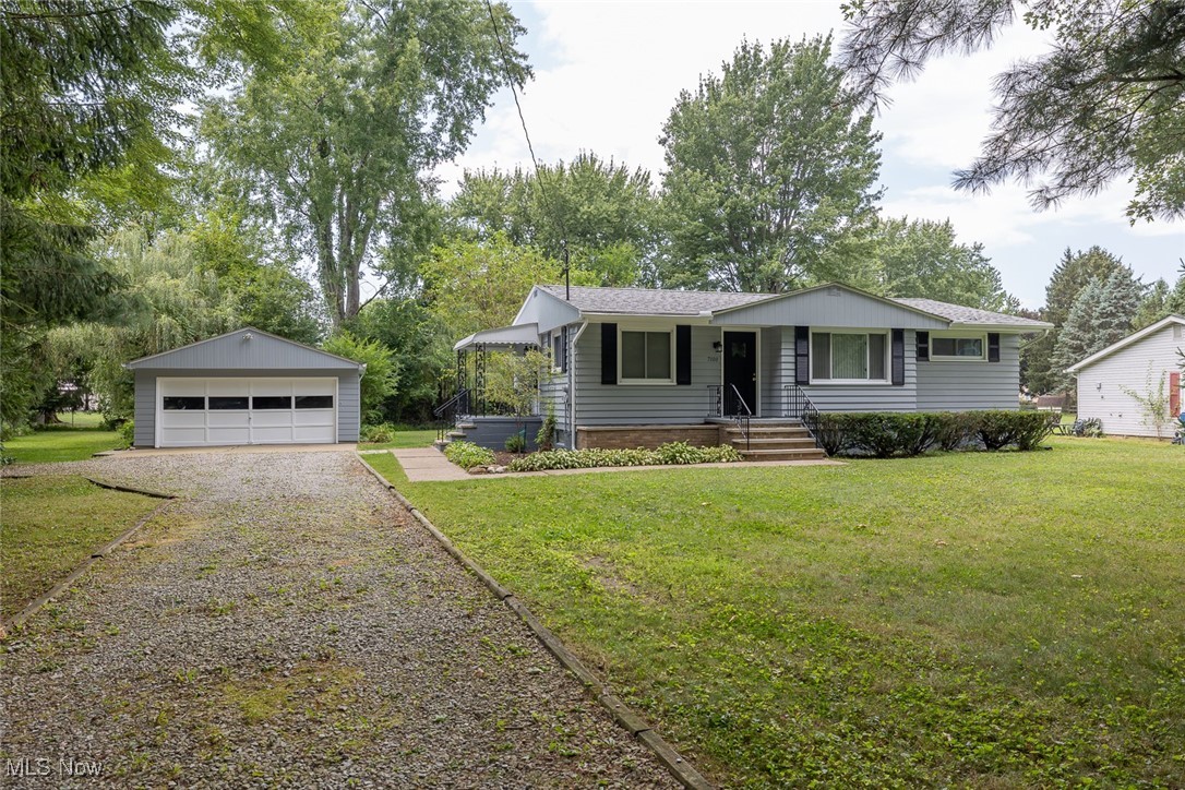 Welcome to 7100 Fairacres Ave, a beautifully updated ranch nestled on a generous half-acre lot in North Ridgeville. This charming 3-bedroom, 1-bath home blends classic style with modern upgrades, making it truly move-in ready. Step inside to find fresh professional interior and exterior paint (2025) that brightens every room, complemented by new LVP flooring in the kitchen and bathroom, and stylish new lighting fixtures throughout. The spacious living and dining areas feature gleaming hardwood floors, perfect for both relaxing and entertaining. The kitchen offers ample space for cooking and dining, while the updated bathroom adds a fresh, modern touch. Updates include: new roof (2022), hot water tank (2023), conversion from septic to public sewer (2003), professional painting (2025), new LVP flooring (2025), new lighting fixtures (2025), and front yard landscaping (2025). The basement provides additional storage and laundry space, and the 2-car detached garage sits just steps away. Outside, enjoy a partially fenced backyard with mature trees, offering privacy and space to play or garden. Conveniently located near schools, parks, and shopping, this home is ready for its next chapter—schedule your showing today!