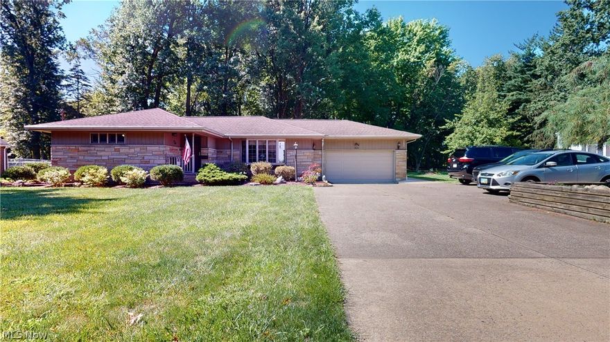 This beautiful, large, brick Ranch is nicely situated on a park-like, almost one-acre lot, which backs up to a stream. Enjoy country living in the city on this brand new, concrete back patio that is a wonderful  place to relax and entertain while also experiencing the views of nature in the backyard full of large shade trees and 3 storage sheds. The patio has a wrap-around sidewalk that leads to the attached 2 car garage with a generous turn around driveway.  The garage leads to the eat-in kitchen, featuring glass door, lighted, maple cabinets, and plenty of storage.  This level has an open floor plan with a newly renovated bathroom of considerable size, complete with a spa tub. There is new ceramic flooring in half of the house and original hardwood throughout. The basement is finished with a rec room and full bathroom, it was waterproofed 6-7 years ago and has a transferable warranty. This home has been renovated to be handicap accessible and features newer windows(Anderson), roof, h