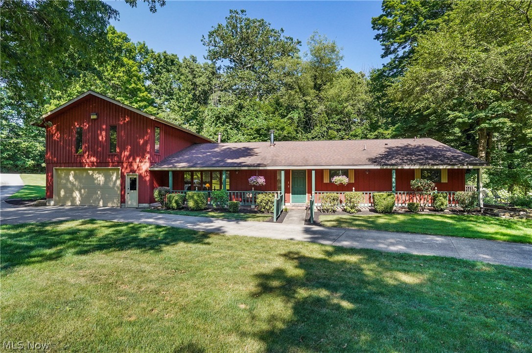 Fabulous home and property nestled on 2.8 wooded acres presents an idyllic setting and boasts an enchanting covered bridge across Yellow Creek. The well manicured grounds highlight an expansive patio, decks, front porch, and walkways. Welcoming foyer with wood floor leads to engaging living room with brick wood burning fireplace and wall of windows. Inviting family room features woodburning stove, window seat, and track lighting. Bright kitchen offers cherry cabinetry, Jenn-Air SS appliances including double ovens (with exception of microwave), pantry cabinet, and access door to side deck. Adjacent butlers pantry with pocket door. Separate eating area with bay window. Staircase to extra large owners suite highlighting a luxurious spa-like bath with free standing tub (Oasis), zero entry shower and Wifi Connected, App Driven Shower Controller, bidet, skylight, and nearby WIC. Three additional generous sized bedrooms on first floor (with California closets), one en-suite with slider to patio, and a main full bath w/quartz counters.
Notable amenities include HVAC '20, all baths remodeled '18, R/O system, all new attic insulation '23, extra large gutters, iron filter and water softener '14, and Nest thermostat.
2 c gar. Outbuilding offers multi purpose rm/office space and storage.